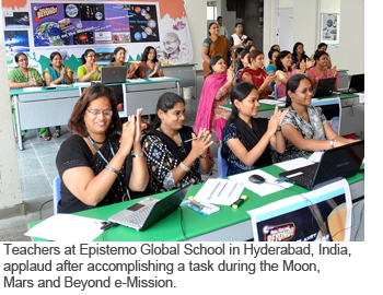 Teachers at Epistemo Global School in Hyderabad, India, applaud after accomplishing a task during the Moon, Mars and Beyond e-Mission.